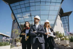 three-architects-standing-front-building-scaled